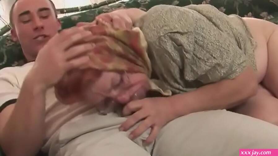 This mature slut is well over 50 fucks with a young boy on the couch