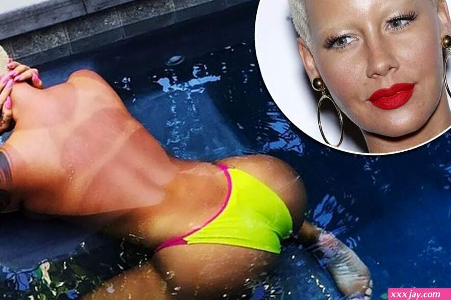 Amber Rose poses half-naked in swimming pool and shows off some shocking tan lines