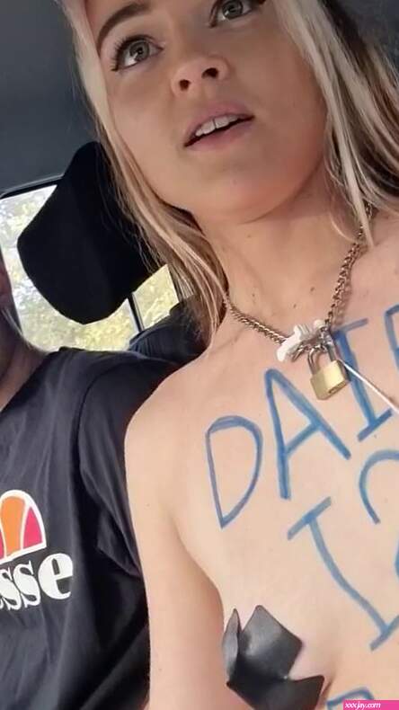 Vegan activist Tash Peterson protests topless outside court in Perth